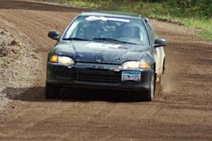 Matt Himes / Silas Himes drift their Honda Civic through a sweeper on stage two.