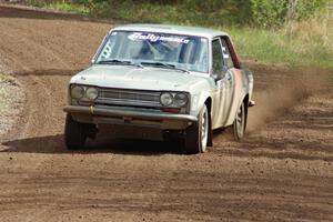 Jim Scray / Colin Vickman drift through a sweeper on stage two in their Datsun 510.