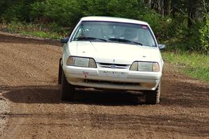 Bonnie Stoehr / Dave Walton drift their Ford Mustang through a corner on stage two.