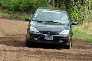 Pawel Dubina / Karol Dubina drift their Ford Focus through a sweeper on stage two.