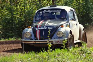 The Mark Huebbe / John Huebbe VW Beetle through a sweeper on stage three.