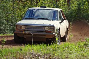 The Jim Scray / Colin Vickman Datsun 510 drifts through a sweeper on stage three.