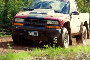 The Jim Cox / Mark Holden Chevrolet S-10 drifts through a sweeper on stage three.