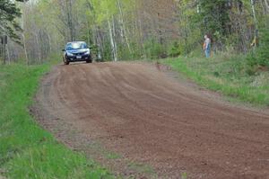 Pawel Dubina / Karol Dubina come over a crest on stage three in their Ford Focus.