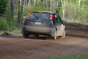 Pawel Dubina / Karol Dubina head downhill into a sweeper in their Ford Focus.