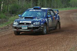 The Carl Siegler/ David Goodman Subaru WRX STi sets up for a sweeper on the final stage.