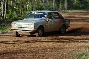 The Jim Scray / Colin Vickman Datsun 510 sets up for a sweeper on stage four.