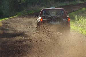 The Jim Cox / Mark Holden Chevrolet S-10 sprays gravel through an uphill sweeper on stage four.