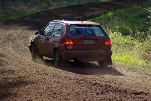 The John Kimmes / Greg Smith VW GTI through an uphill sweeper on stage four.