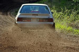 The Bonnie Stoehr / Dave Walton Ford Mustang	drifts through a sweeper on stage four.