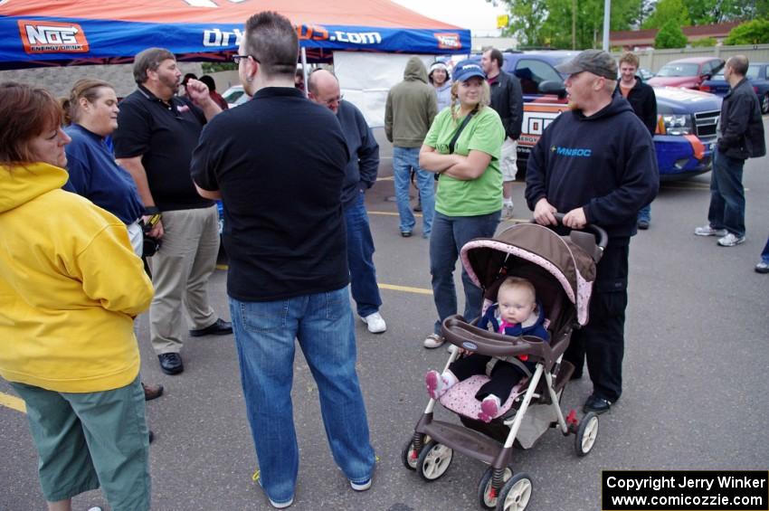 A group of people conversing and enjoying Rallyfest.