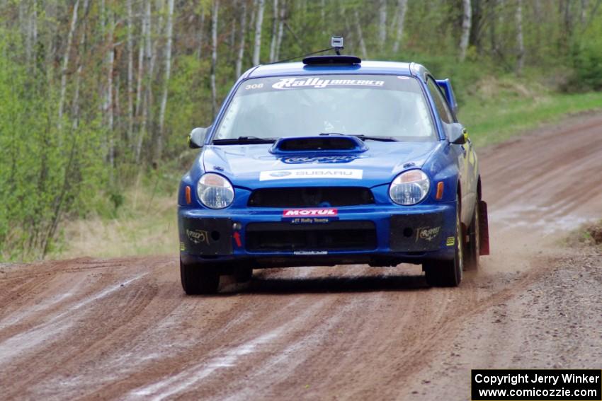 Janusz Topor / Michal Kaminski at speed on stage one in their Subaru WRX STi.