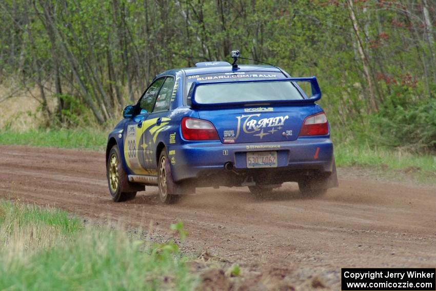Janusz Topor / Michal Kaminski at speed on stage one in their Subaru WRX STi.