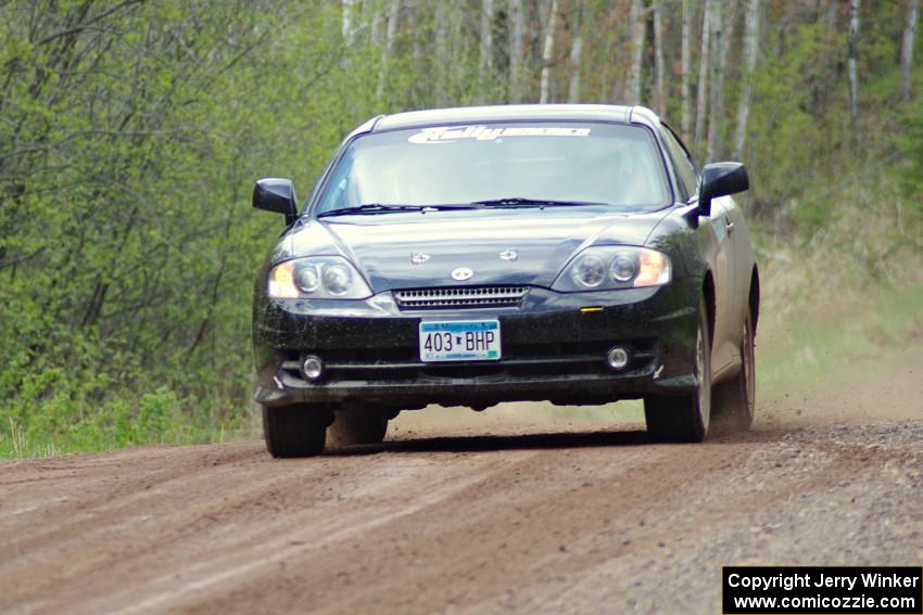 The Derek McCorison / Paul Johansen Hyundai Tiburon at speed on stage one.