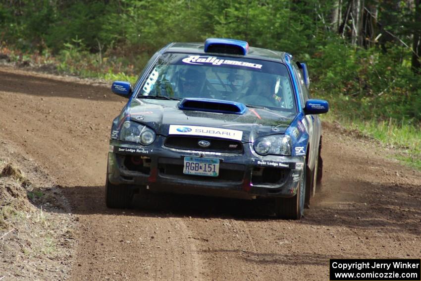 The Carl Siegler/ David Goodman Subaru WRX STi exits a sweeper on stage two.