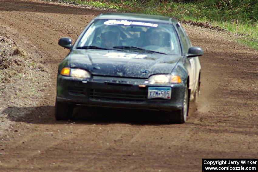 Matt Himes / Silas Himes drift their Honda Civic through a sweeper on stage two.