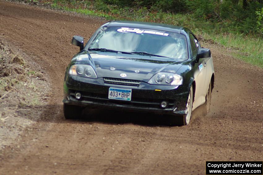 The Derek McCorison / Paul Johansen Hyundai Tiburon drifts through a sweeper on stage two.