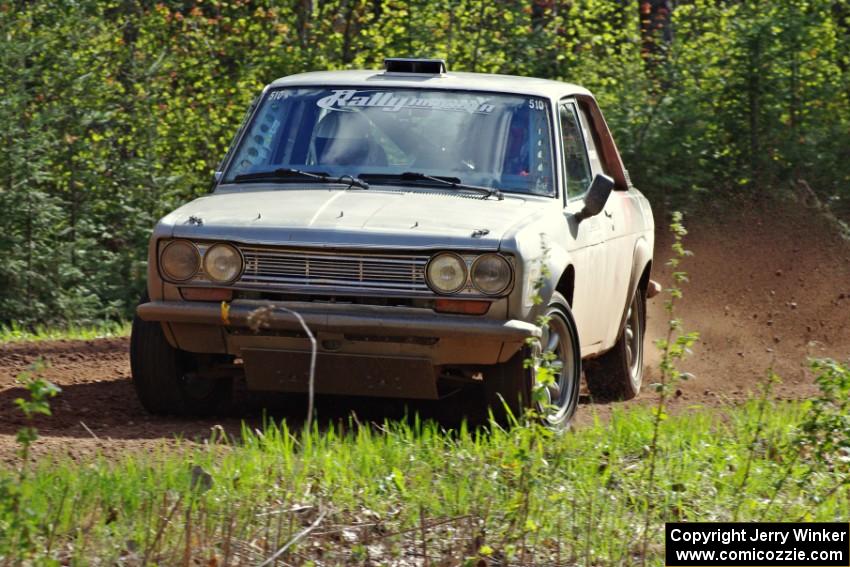 The Jim Scray / Colin Vickman Datsun 510 drifts through a sweeper on stage three.