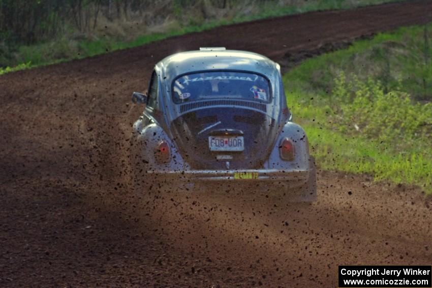 The Mark Huebbe / John Huebbe VW Beetle slings gravel at an uphill sweeper on stage four.