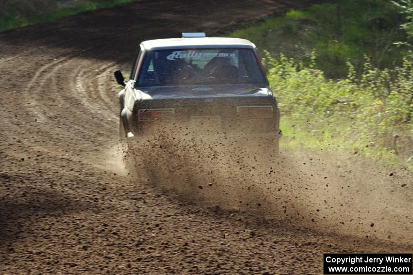 The Jim Scray / Colin Vickman Datsun 510 drifts through a sweeper on stage four.