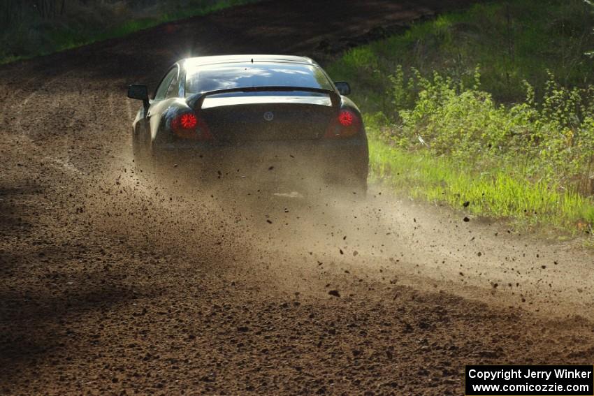 The Derek McCorison / Paul Johansen Hyundai Tiburon drifts through a sweeper on stage four.