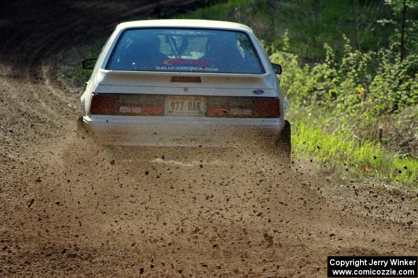 The Bonnie Stoehr / Dave Walton Ford Mustang	drifts through a sweeper on stage four.