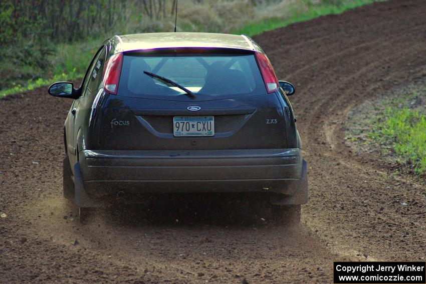 The Pawel Dubina / Karol Dubina Ford Focus drifts through a sweeper on stage four.