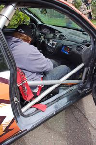 Ben Slocum sits on the freshly-repaired side of the Ford Focus he and Dillon Van Way shared.