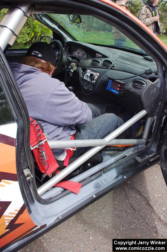 Ben Slocum sits on the freshly-repaired side of the Ford Focus he and Dillon Van Way shared.