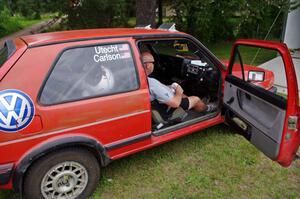 Mark Utecht sits in the VW GTI he shared with Brent Carlson