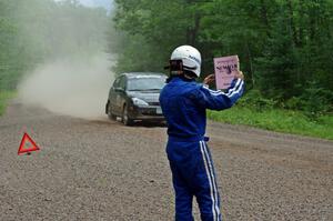 Dave Goodman lets the Pawel Dubina / Karol Dubina Ford Focus know they're 'OK' on SS3.