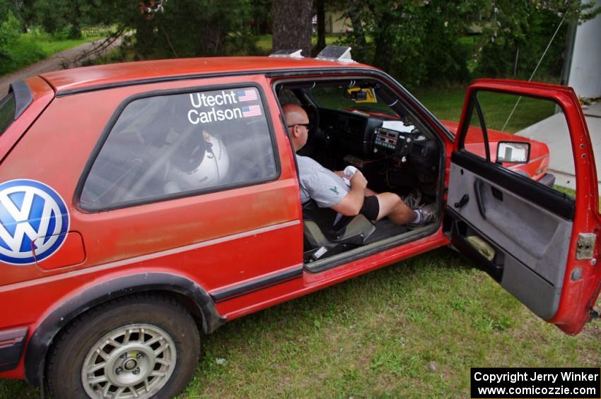 Mark Utecht sits in the VW GTI he shared with Brent Carlson