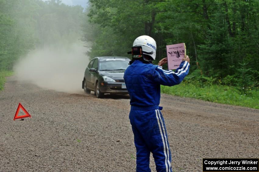 Dave Goodman lets the Pawel Dubina / Karol Dubina Ford Focus know they're 'OK' on SS3.