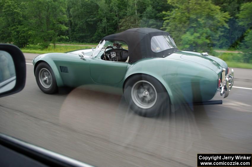 A REAL AC Cobra on the highway headed to the rally!