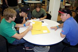 Dillon Van Way, ???, ???, Jake Blattner and Graham Evans discuss notes.