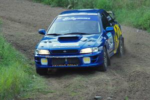 Piotr Fetela / Ray Vambuts in their Subaru Impreza STi on SS1