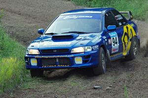 Piotr Fetela / Ray Vambuts in their Subaru Impreza STi on SS1