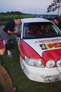 Jan Zedril / Jody Zedril, in their Mitsubishi Lancer ES, are filmed by a Canadian TV crew.
