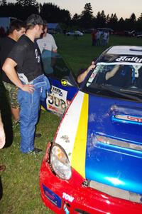 John Topor surveys damage to his Subaru WRX STi that rolled on SS1.