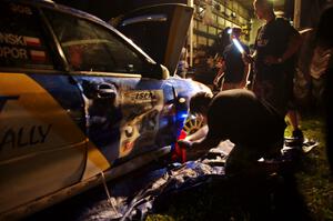 Work is performed on the Janusz Topor / Michal Kaminski Subaru WRX STi at Friday's service.