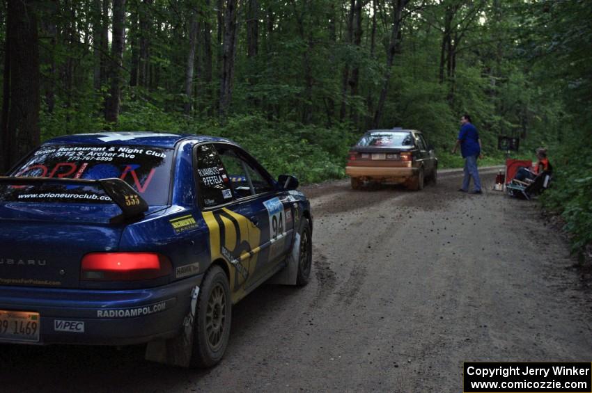 Matt Bushore / Andy Bushore, in their VW Jetta, start SS3 as the Piotr Fetela / Ray Vambuts Subaru Impreza STi waits.