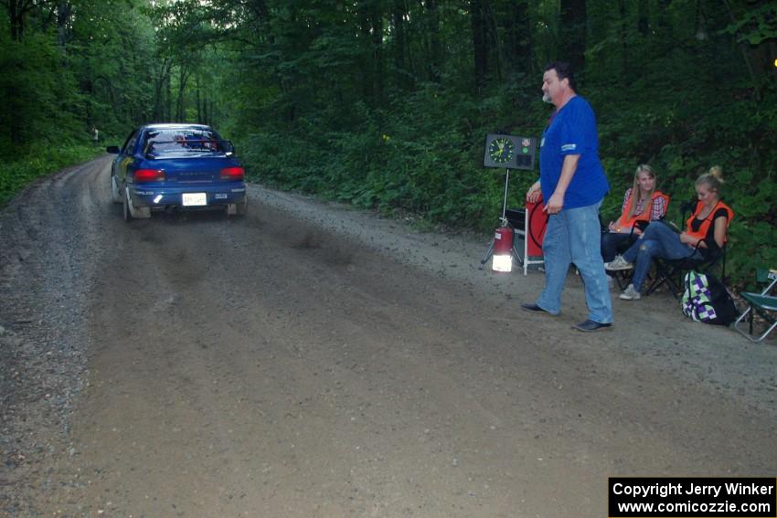 Piotr Fetela / Ray Vambuts, in their Subaru Impreza STi, leaves the start of SS3.