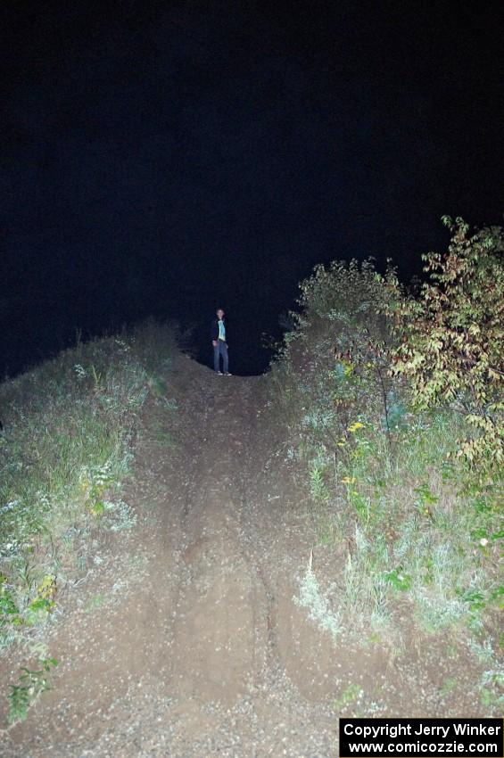 Tim Williams scouts photo spots atop the gravel mound.