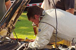 Chris Greenhouse does some last minute repairs to his Plymouth Neon at parc expose.