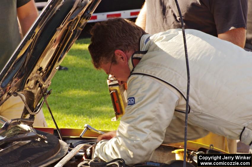 Chris Greenhouse does some last minute repairs to his Plymouth Neon at parc expose.