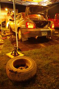 A blown tire from the Anthony Israelson / Jason Standage Subaru Impreza lays on the ground at service.