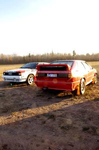 Tim Maskus' and Curt Egerer's Audi Quattros parked at the practice stage