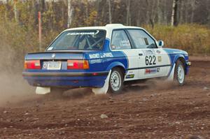 Scott Sanford / Joel Sanford in their BMW 325i on the practice stage