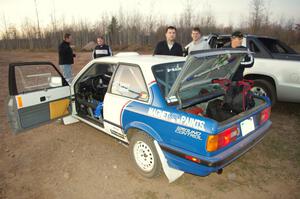 Scott Sanford / Joel Sanford in their BMW 325i after the practice stage