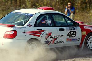 Scott Crouch / Rebecca Greek in their Subaru WRX on SS1 (Green Acres I)